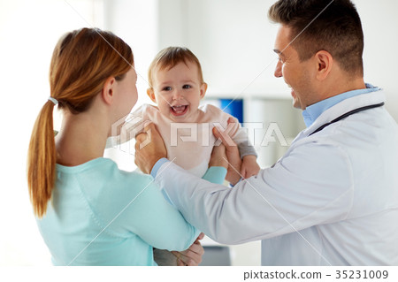 happy woman with baby and doctor at clinic 35231009