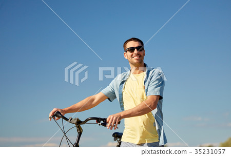 happy smiling man with bicycle outdoors happy smiling man with bicycle outdoors 35231057