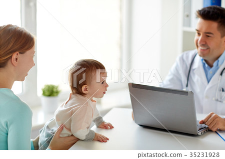 woman with baby and doctor with laptop at clinic woman with baby and doctor with laptop at clinic 35231928