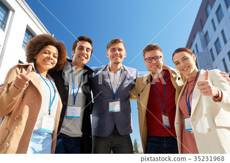 business team with conference badges in city 35231968