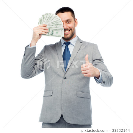 smiling businessman with money showing thumbs up 35232144