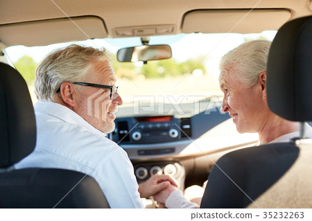 happy senior couple driving in car happy senior couple driving in car 35232263