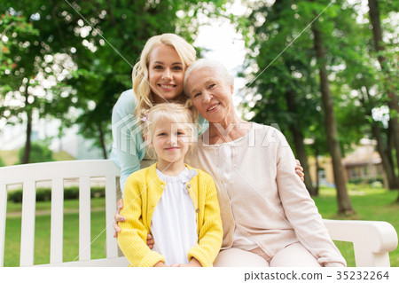 woman with daughter and senior mother at park woman with daughter and senior mother at park 35232264