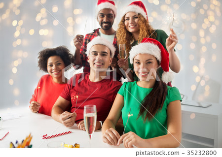happy team celebrating christmas at office party 35232800