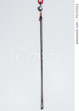 Chain hangs on the hook of the crane  35232922