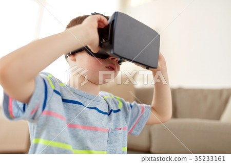 little boy in vr headset or 3d glasses at home 35233161