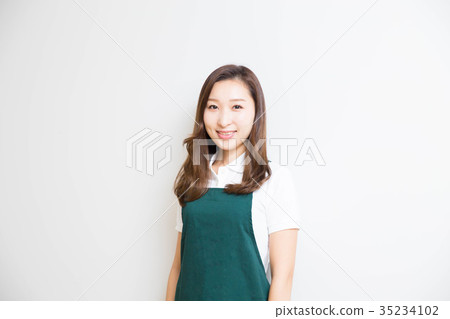 A woman in an apron A woman in an apron 35234102