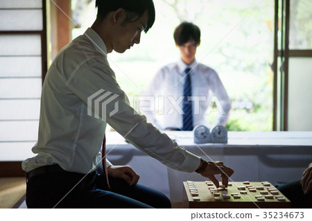 Men pointing to Shogi 35234673