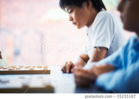 Boy pointing at shogi 35235187