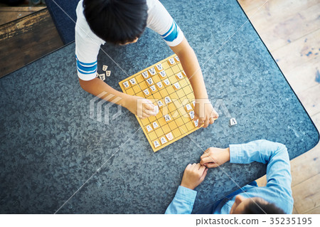 Boy pointing at shogi 35235195