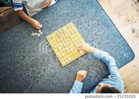 Boy pointing at shogi 35235205