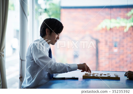 Men pointing to Shogi Men pointing to Shogi 35235392