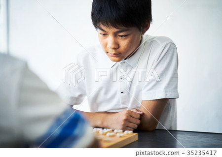 Boy pointing at shogi 35235417