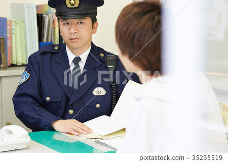 Men speaking in a police box 35235519