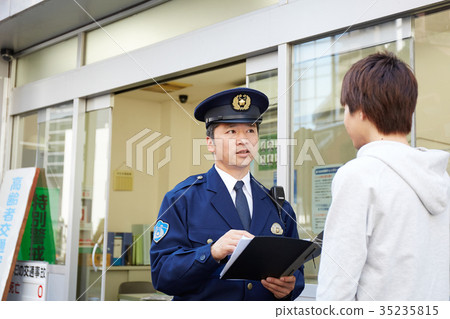 Men speaking in a police box 35235815