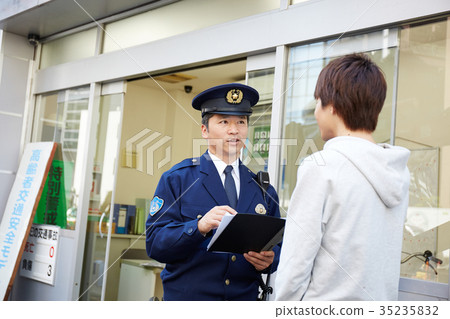 Men speaking in a police box 35235832