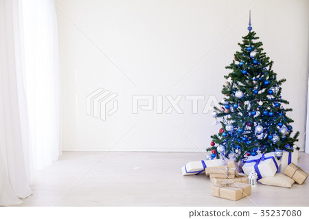 Christmas tree with blue in a white room with toys 35237080