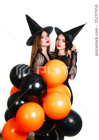 Two happy sexy women in black witch halloween 35237458