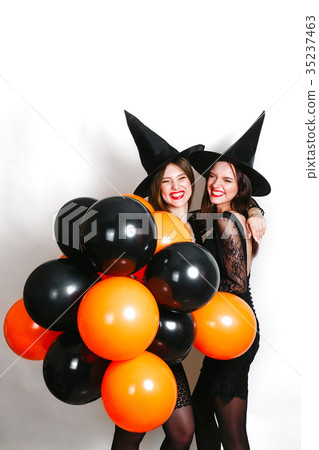 Two happy sexy women in black witch halloween 35237463