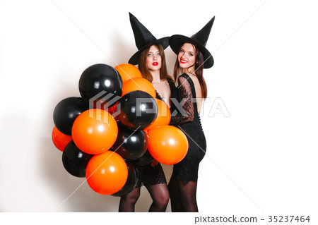 Two happy sexy women in black witch halloween 35237464