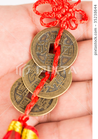 Ancient Feng shui metal lucky coins on the hand Ancient Feng shui metal lucky coins on the hand 35238644