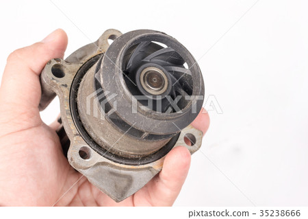 Old car water pump in the hand on white background Old car water pump in the hand on white background 35238666