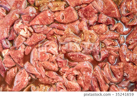 图库照片: close-up pieces of raw pork liver