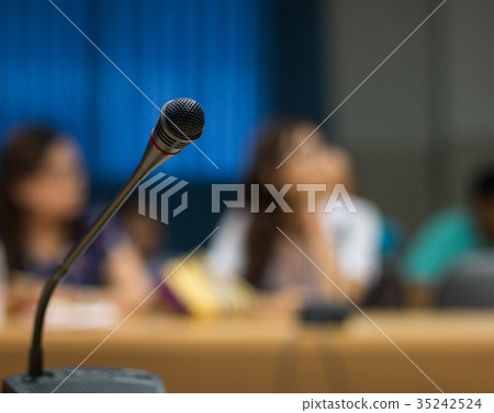 Soft focus of  microphones in conference room 35242524