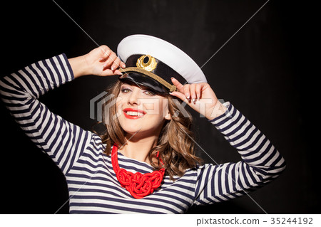 a girl in a cap style fashion pinup 35244192