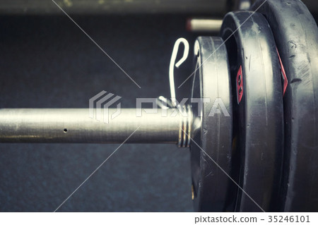 piece of barbell with heavy weights piece of barbell with heavy weights 35246101