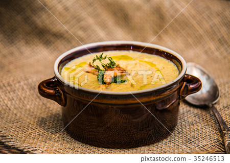 fish creme soup on a wooden table 35246513