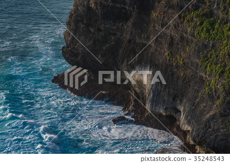 Waves hit the rock. Famous Uluwatu temple in Bali 35248543
