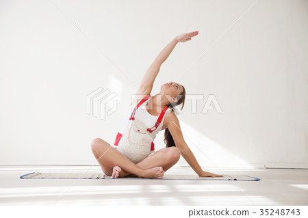 a pregnant woman is engaged in gymnastics and yoga 35248743
