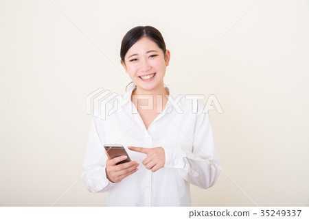 young asian woman using smart phone young asian woman using smart phone 35249337