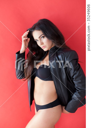 brunette girl in leather jacket and black lingerie 35249606