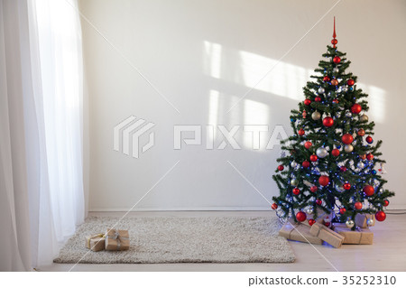 Christmas tree in a white room for Christmas with Christmas tree in a white room for Christmas with 35252310