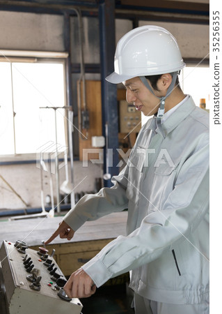 Factory person working die casting 35256355