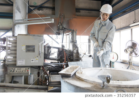 Factory person working die casting Factory person working die casting 35256357