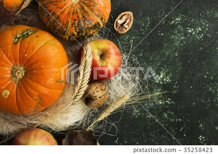 Autumn harvest - pumpkins, apples, nuts, wheat 35258423