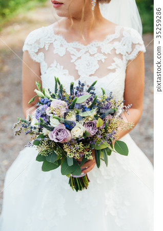 beautiful bouquet in hands of the bride beautiful bouquet in hands of the bride 35259286