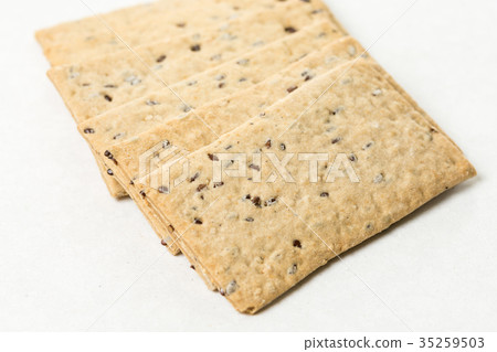 Flax chips isolated above white marble background Flax chips isolated above white marble background 35259503