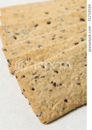 Flax chips isolated above white marble background Flax chips isolated above white marble background 35259504