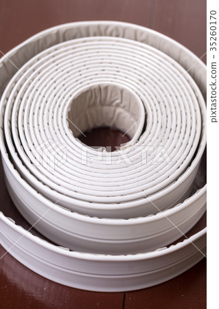 White sanitary sealant strip on the table 35260170