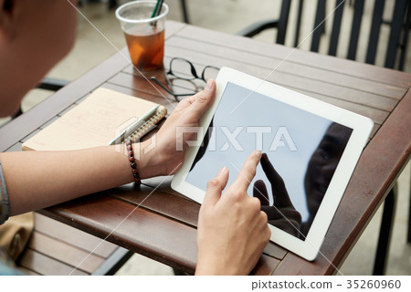 Working on tablet computer Working on tablet computer 35260960