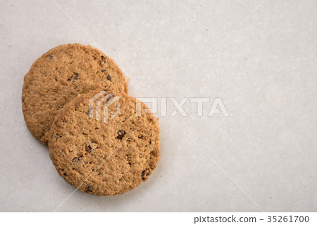 Brown chocolate biscuits isolated on the marble Brown chocolate biscuits isolated on the marble 35261700