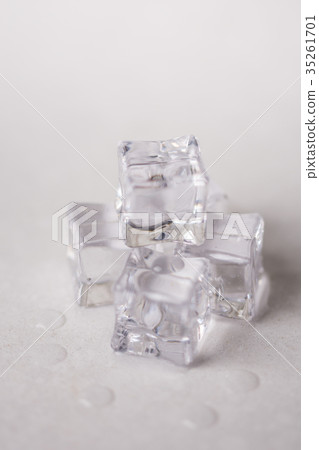 Ice cubes with water drops on the white marble Ice cubes with water drops on the white marble 35261701