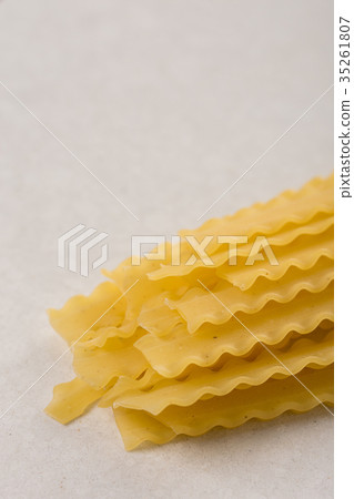 Yellow crisp macaroni isolated on the white marble Yellow crisp macaroni isolated on the white marble 35261807