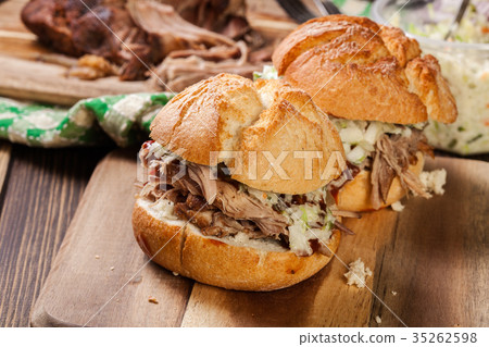 Homemade pulled pork burger with coleslaw salad Homemade pulled pork burger with coleslaw salad 35262598