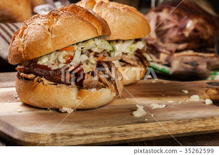 Homemade pulled pork burger with coleslaw salad Homemade pulled pork burger with coleslaw salad 35262599