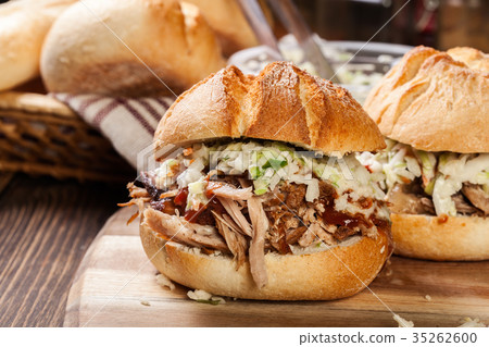 Homemade pulled pork burger with coleslaw salad 35262600